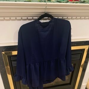 Navy blue blouse.  Cross over front closing with tie. Simple yet sophisticated!